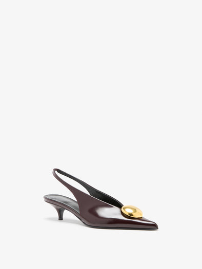Proenza Schouler 3/4 Still Life image of Dome Slash Slingbacks in Polished Calf in Merlot