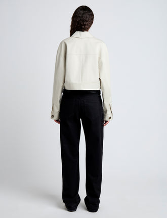 Back image of model wearing Dylan Jacket in Organic Cotton Twill in wheat