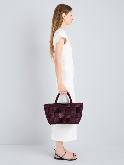 Proenza Schouler Image of model wearing East West Chelsea Tote in Raffia in Plum