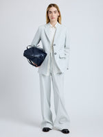 Proenza Schouler Front full length image of model wearing the Eva Jacket in Cotton Viscose Suiting in Pale Grey