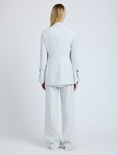 Proenza Schouler Back full length image of model wearing the Eva Jacket in Cotton Viscose Suiting in Pale Grey
