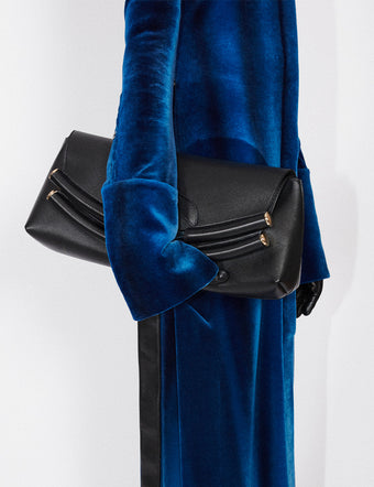 Cropped image of model in Ice Dyed Velvet Shirt Dress in cobalt, carrying black Bar Bag