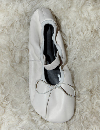 Aerial image of Glove Mary Jane Flats in cream on shearling backdrop
