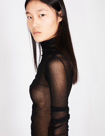 Side image of model in black Viscose Gauze Knit Top