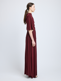 Proenza Schouler Side full length image of model wearing Frankie Dress in Matte Jersey in oxblood