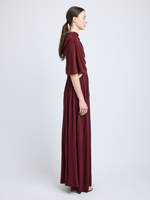 Proenza Schouler Side full length image of model wearing Frankie Dress in Matte Jersey in oxblood