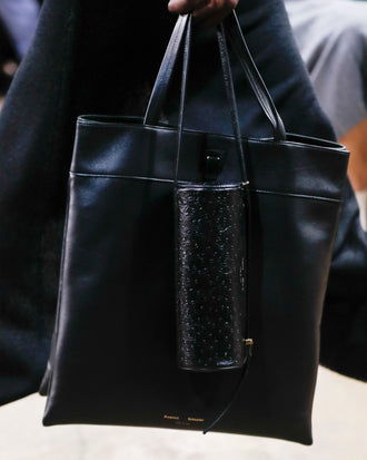 Image of model walking Proenza Schouler Fall Winter 2024 Runway wearing Split Tote in black