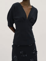 Proenza Schouler Detail image of model wearing Darena Top in Compact Stretch Crepe in Black