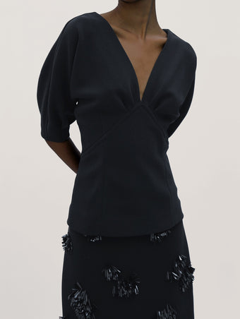 Proenza Schouler Detail image of model wearing Darena Top in Compact Stretch Crepe in Black