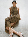 Proenza Schouler Editorial Image of model Laying on the concrete floor wearing the Maelle Top in Drop Needle Tweed Black Multi and the Maelle Skirt in Drop Needle Tweed in Black Multi with the Tee Knot Sandals in Nappa in White