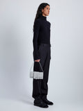 Image of model wearing Flip Shoulder Bag in Nappa in Light Grey