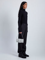 Image of model wearing Flip Shoulder Bag in Nappa in Light Grey