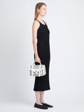 Image of model wearing PS1 Tiny Bag In Perforated Leather in OPTIC WHITE