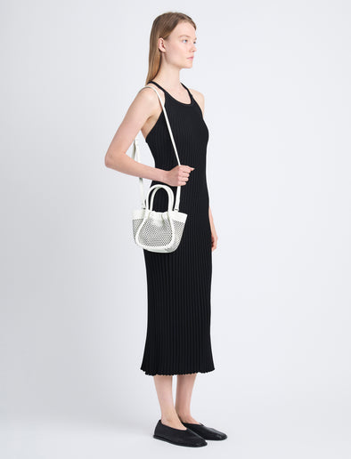 Image of model wearing Extra Small Ruched Tote in Perforated Leather in OPTIC WHITE