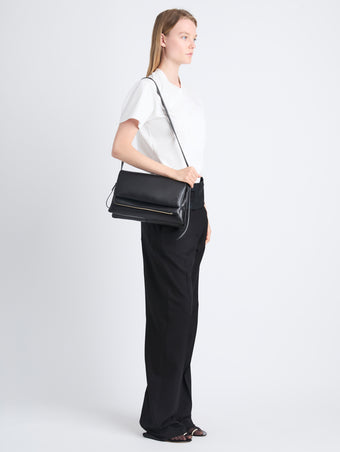 Image of model carrying City Bag in Black on shoulder