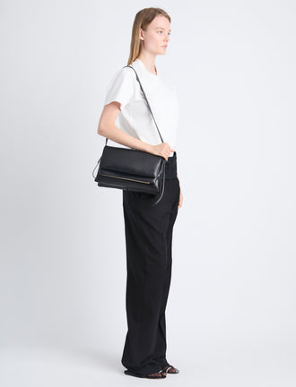 Image of model carrying City Bag in Black on shoulder