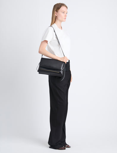 Image of model carrying City Bag in Black on shoulder