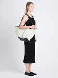 Image of model wearing XL Chelsea Tote in Canvas in black/natural 