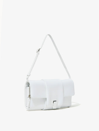 Side image of Flip Shoulder Bag in Optic White with strap