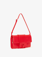 Side image of Flip Shoulder Bag with strap in red