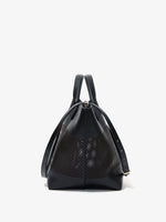 Side image of Large Chelsea Tote in Perforated Leather in black