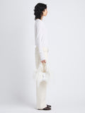 Image of model holding Park Shoulder Bag In Optic White Nylon With Feathers