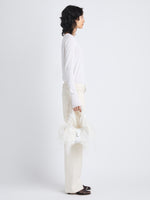 Image of model holding Park Shoulder Bag In Optic White Nylon With Feathers