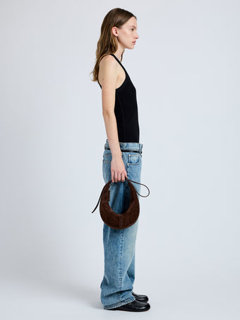 Image of model wearing Slide Bag in Soft Suede in Chocolate