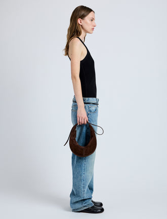 Image of model wearing Slide Bag in Soft Suede in Chocolate
