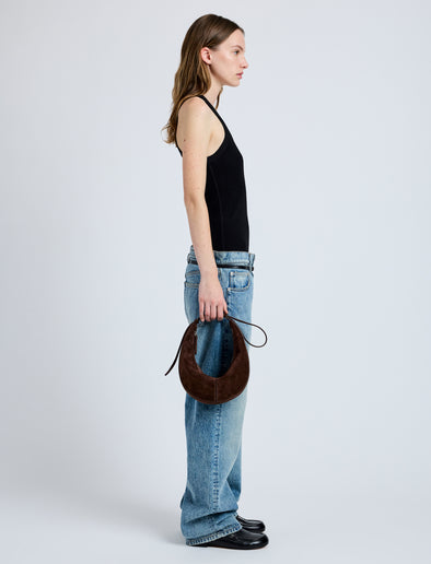 Image of model wearing Slide Bag in Soft Suede in Chocolate