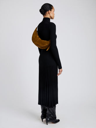 Image of model wearing Slide Bag in Soft Suede in Fern