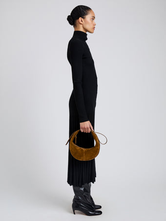 Image of model wearing Slide Bag in Soft Suede in Fern