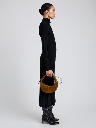 Image of model wearing Slide Bag in Soft Suede in Fern