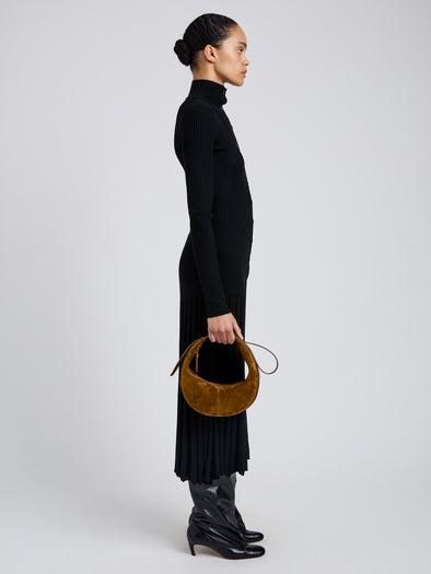 Image of model wearing Slide Bag in Soft Suede in Fern