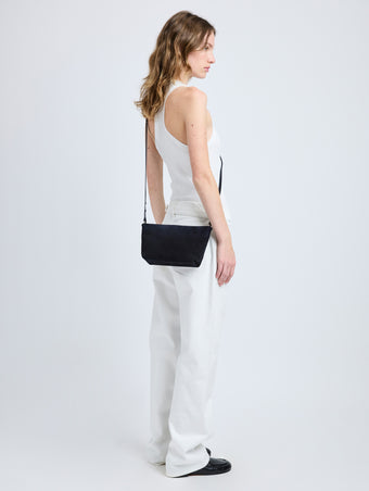 Image of model wearing Bond Bag in Suede in Chocolate