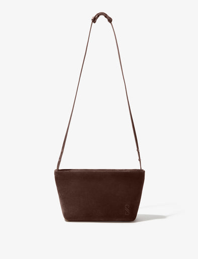 Front image of Bond Bag in Suede in Chocolate with strap extended