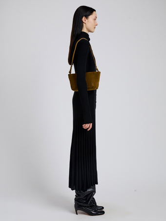 Image of model wearing Bond Bag in Suede in Fern