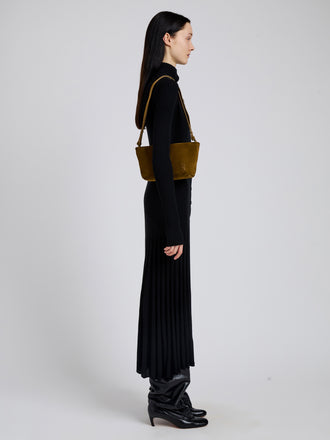 Image of model wearing Bond Bag in Suede in Fern