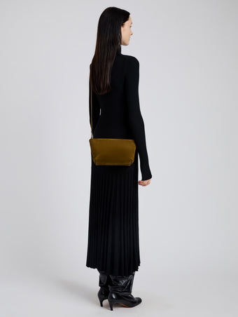 Image of model wearing Bond Bag in Suede in Fern