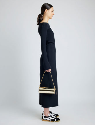Image of model wearing Silo Bag in Soft Mirrored Fabric in LIGHT GOLD