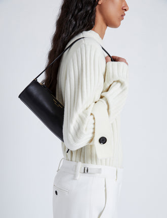 Cropped Image of model carrying Silo Bag in black