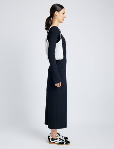 Image of model wearing Slope Shoulder Bag In Soft Spazzolato in OPTIC WHITE
