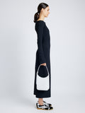Image of model wearing Slope Shoulder Bag In Soft Spazzolato in OPTIC WHITE