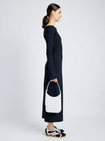 Image of model wearing Slope Shoulder Bag In Soft Spazzolato in OPTIC WHITE