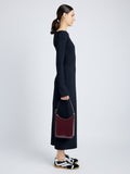 Image of model wearing Slope Shoulder Bag In Soft Spazzolato in DARK RED