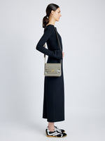 Side image of model wearing Monogram Box Bag in SLATE