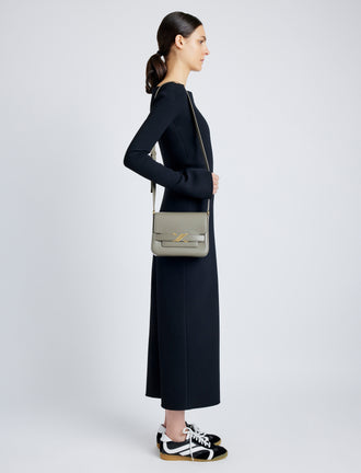 Side image of model wearing Monogram Box Bag in SLATE