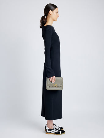 Side image of model carrying Monogram Box Bag in SLATE