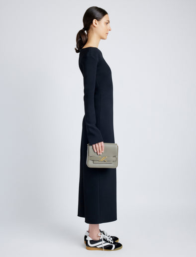 Side image of model carrying Monogram Box Bag in SLATE