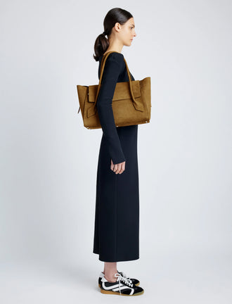Proenza Schouler Front full length image of model carrying Tate Bag in Nubuck Calf in TOBACCO